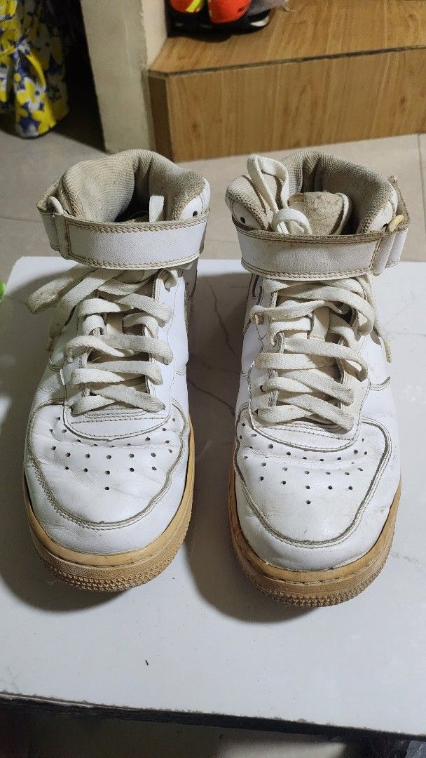 Nike Air Force 1 High Top Sneakers (Category: Sneakers) located in Caloocan City. Submitted by julsbaldo (Listing ID 1436951121, Image 1). Description: - White Nike Air Force 1 high-top sneakers - White leather upper - Beige sole - Velcro strap closure - Nike swoosh logo.