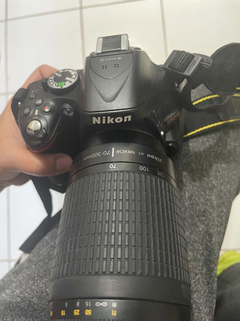 Nikon D5200 DSLR Bundle-Pristine Condition (Ready to Shoot) (Category: Cameras) located in Quezon City. Submitted by gilbertlouie (Listing ID 1436927618, Image 3). Description: What's Included: Camera Body: Nikon D5200 (24.1MP with flip-out Screen) Lenses Kit lens +1 Extra Lens (perfect for portraits/zoom) Essentials: Original charger, data cords, and high-speed SD card Condition: 10/10. Very well maintained, no scratches, and low shutter count. 