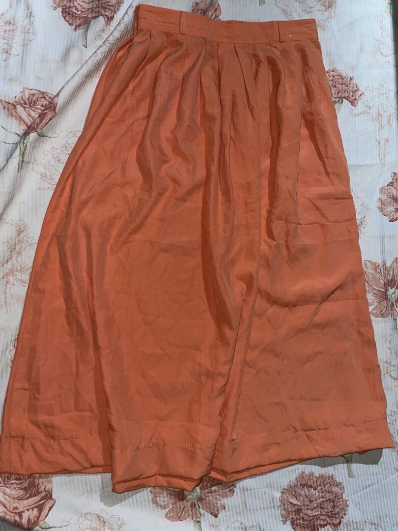 Orange Pleated Maxi Skirt - St. Michael (Category: Skirts) located in Quezon City. Submitted by radiusmile (Listing ID 1436915036, Image 3). Description: - Orange pleated skirt - High-waisted design - Flowing silhouette - Lightweight, warm-weather fabric - Button and zipper closure - Solid color for easy pairing - Garterized back so stretchable - Waistline: 30-34 inches - Length: 31 inches.