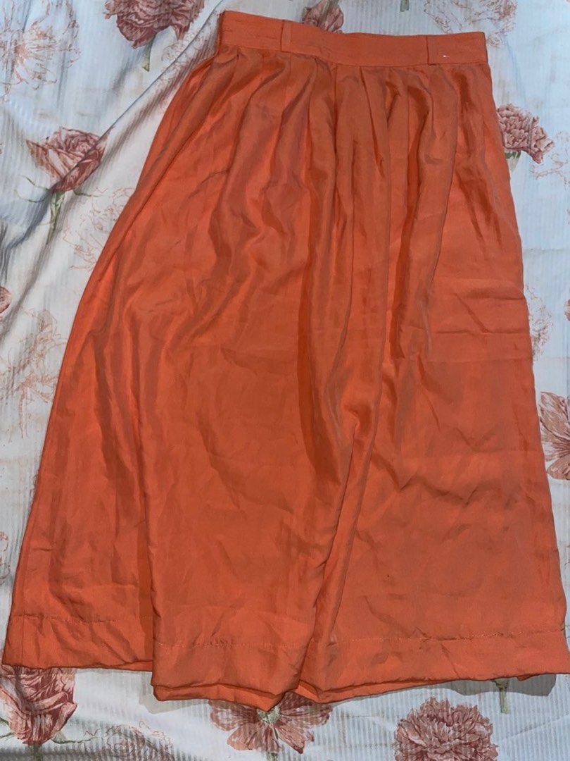Orange Pleated Maxi Skirt - St. Michael (Category: Skirts) located in Quezon City. Submitted by radiusmile (Listing ID 1436915036, Image 1). Description: - Orange pleated skirt - High-waisted design - Flowing silhouette - Lightweight, warm-weather fabric - Button and zipper closure - Solid color for easy pairing - Garterized back so stretchable - Waistline: 30-34 inches - Length: 31 inches.
