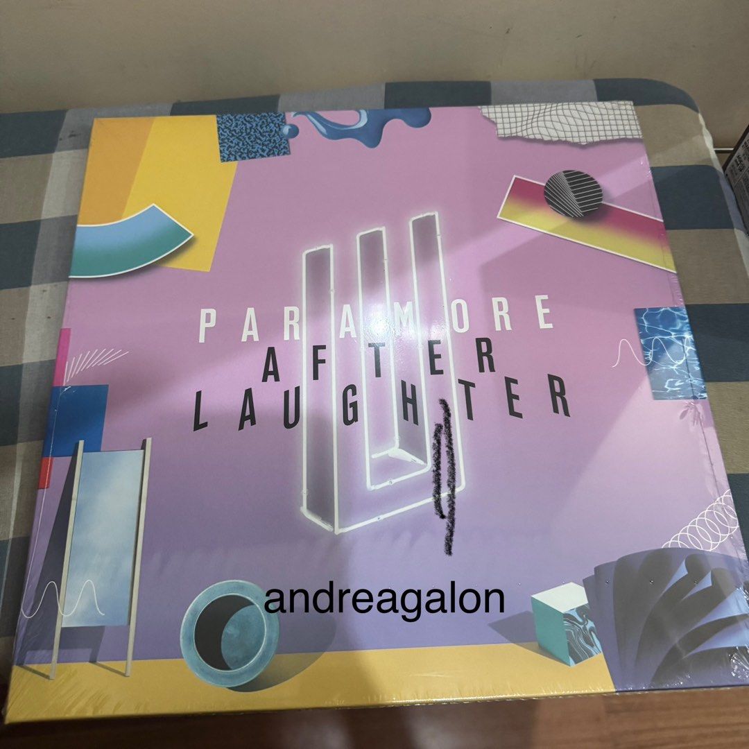 Paramore - After Laughter Vinyl Record (Category: Vinyls) located in Manila. Submitted by puredeer-cc3e (Listing ID 1437002432, Image 1). Description: - Paramore's "After Laughter" on vinyl - Features tracks: "Hard Times," "Rose-Colored Boy," "Fake Happy" - Produced by Justin Meldal-Johnsen & Taylor York - Released by Fueled By Ramen & Atlantic Recording Corporation - Includes back cover with tracklist and details.