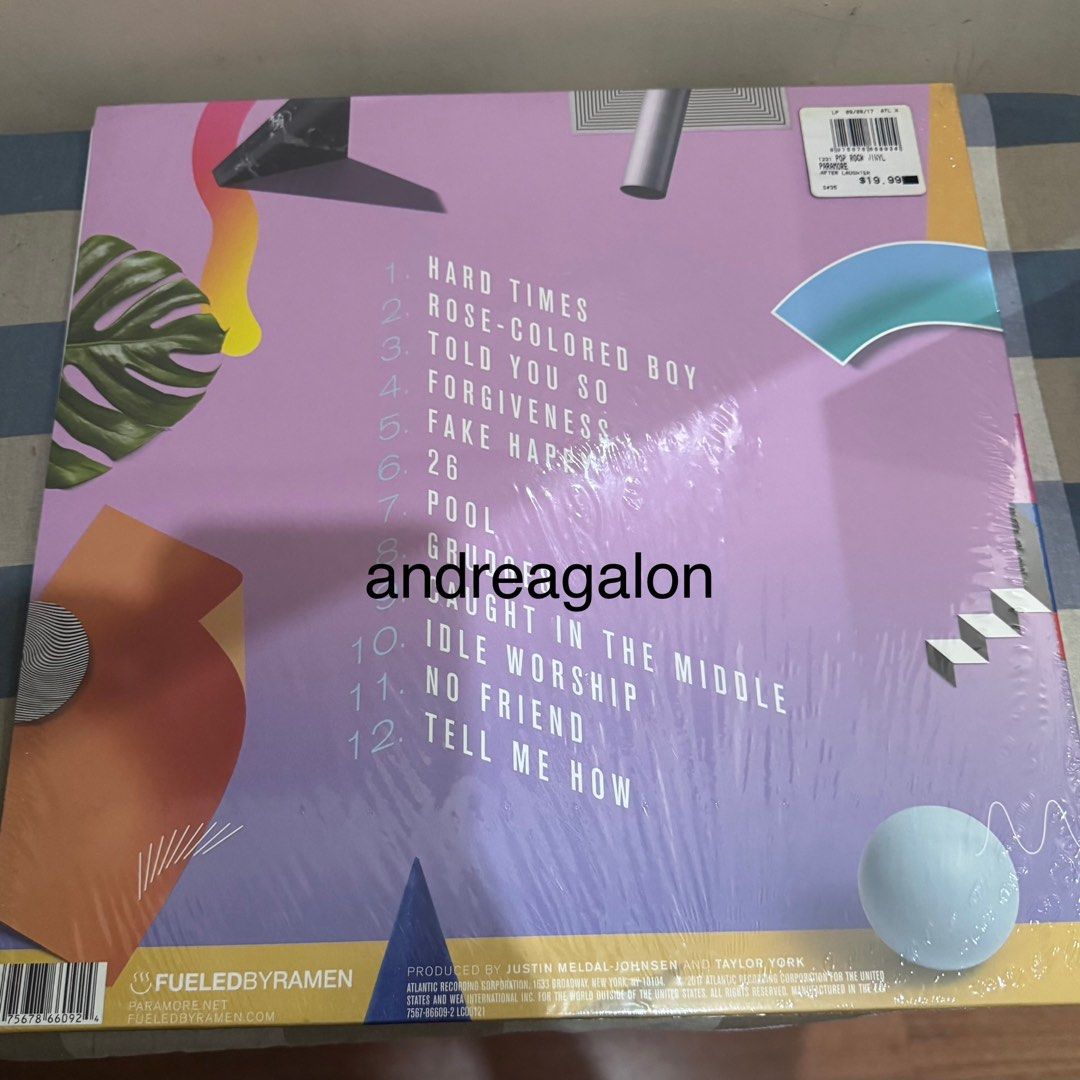 Paramore - After Laughter Vinyl Record (Category: Vinyls) located in Manila. Submitted by puredeer-cc3e (Listing ID 1437002432, Image 2). Description: - Paramore's "After Laughter" on vinyl - Features tracks: "Hard Times," "Rose-Colored Boy," "Fake Happy" - Produced by Justin Meldal-Johnsen & Taylor York - Released by Fueled By Ramen & Atlantic Recording Corporation - Includes back cover with tracklist and details.