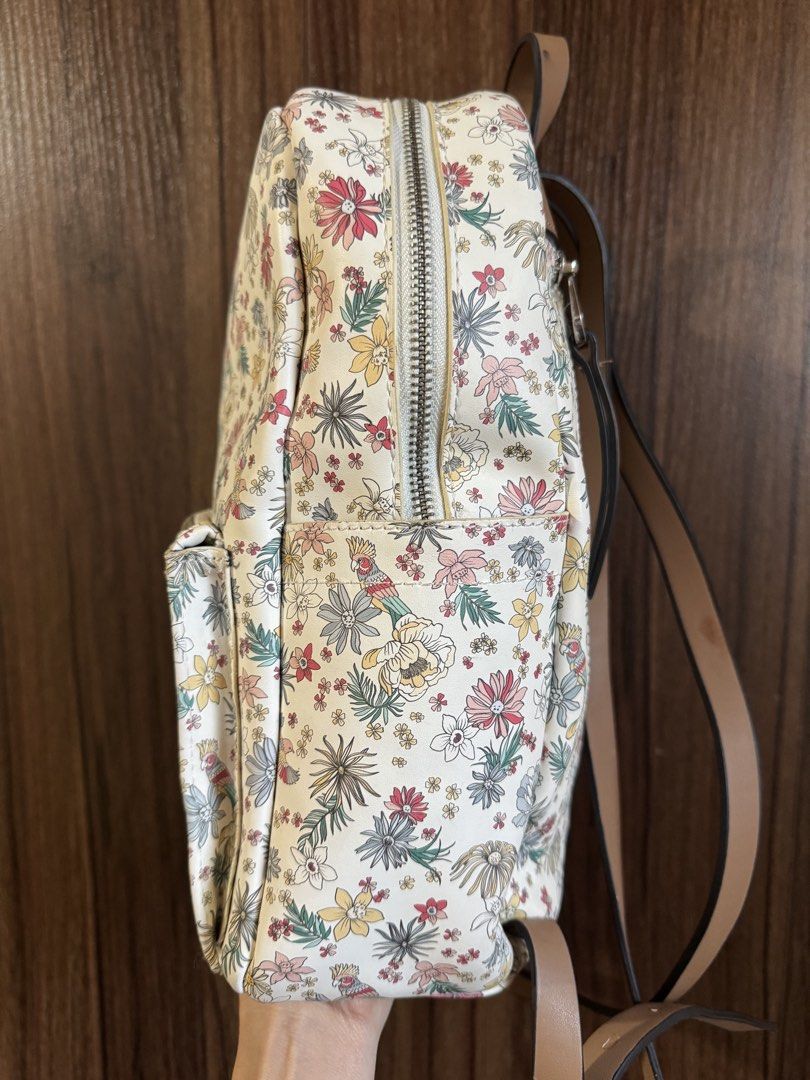Parfois - Floral Print Backpack (Category: Backpacks) located in Mandaluyong City. Submitted by jayannt (Listing ID 1436924739, Image 3). Description: - Floral print design - Front zippered pocket - Two side pockets - Brown straps and top handle - Double zipper closure - Made of durable material.