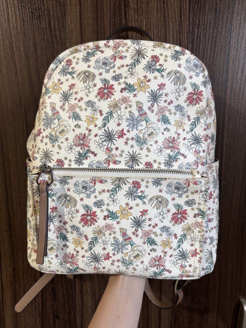 Parfois - Floral Print Backpack (Category: Backpacks) located in Mandaluyong City. Submitted by jayannt (Listing ID 1436924739, Image 1). Description: - Floral print design - Front zippered pocket - Two side pockets - Brown straps and top handle - Double zipper closure - Made of durable material.