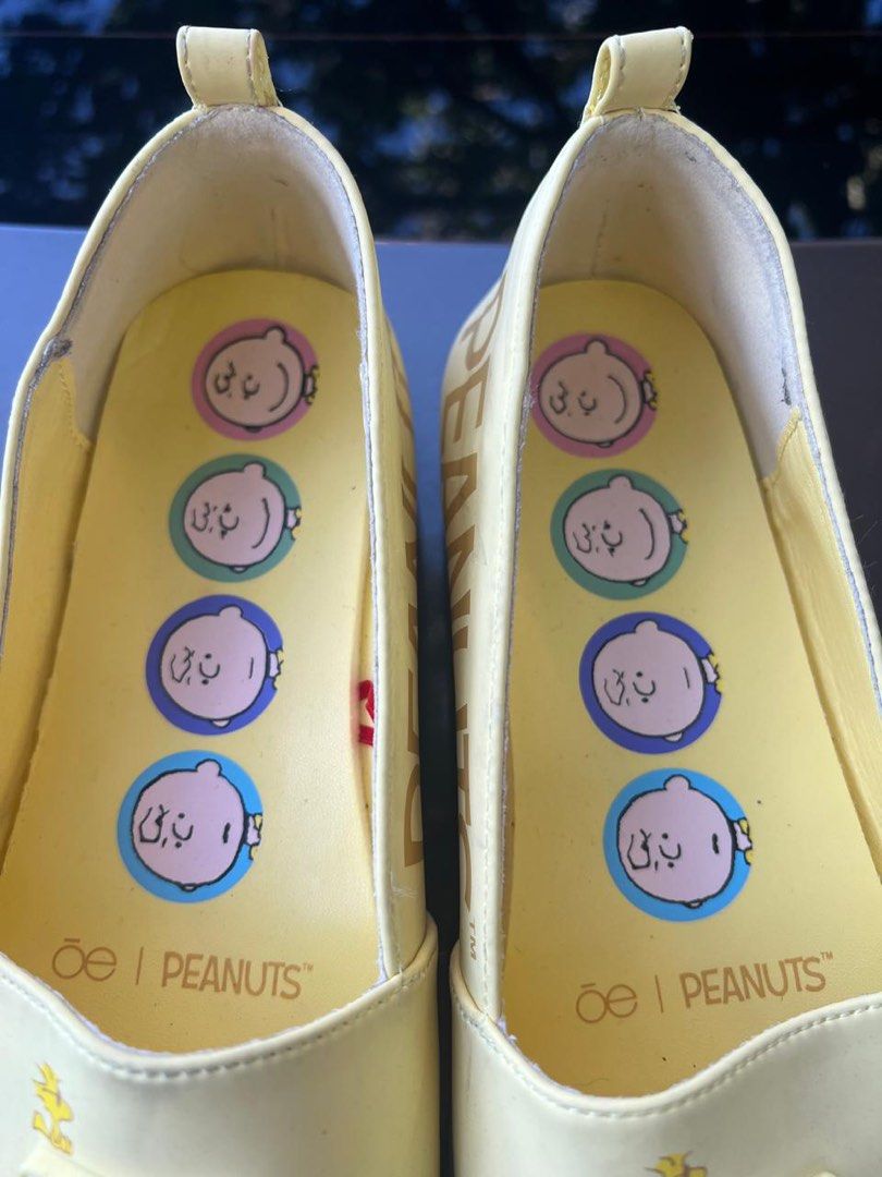 Peanuts x Oe Yellow Slip-on Shoes (Category: Sneakers) located in Manila. Submitted by francisstein (Listing ID 1436864378, Image 2). Description: ✅ Yellow slip-on shoes ✅ Peanuts design ✅ "Be" logo on the front ✅ Snoopy graphics on the insole ✅ "PEANUTS" printed on the side and sole ✅ Collaboration item ✅ The item is still in very good condition. disclaimer : ⛔️We cannot confirm the authenticity, as the shoes were only given to us and no receipt