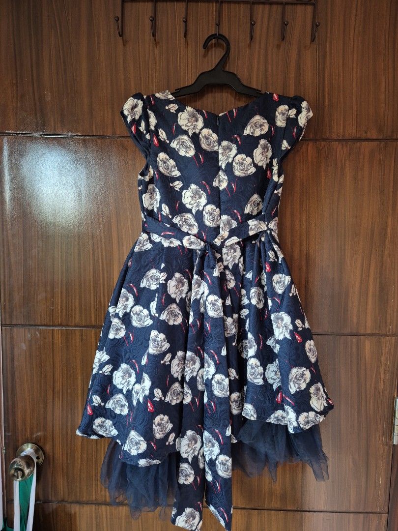 Periwinkle Floral Dress (Category: Babies & Kids Fashion) located in Manila. Submitted by trying_2_declutter (Listing ID 1436920221, Image 2). Description: RFS: Decluttering Price negotiable - Dark blue/navy blue dress with floral design - Features a bow at the back - Tulle underskirt - Size: 12Y - For special occasions - Brand: Periwinkle .