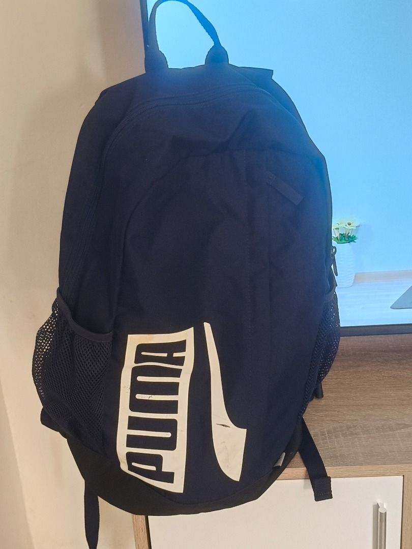 Puma Backpack (Category: Backpacks) located in Caloocan City. Submitted by calmbird.6330a9 (Listing ID 1436971124, Image 1). Description: - Black Puma backpack - Large main compartment - Front pocket for extra storage - Mesh side pockets for water bottles - Adjustable straps - Puma logo on front - Ideal for school or everyday use.