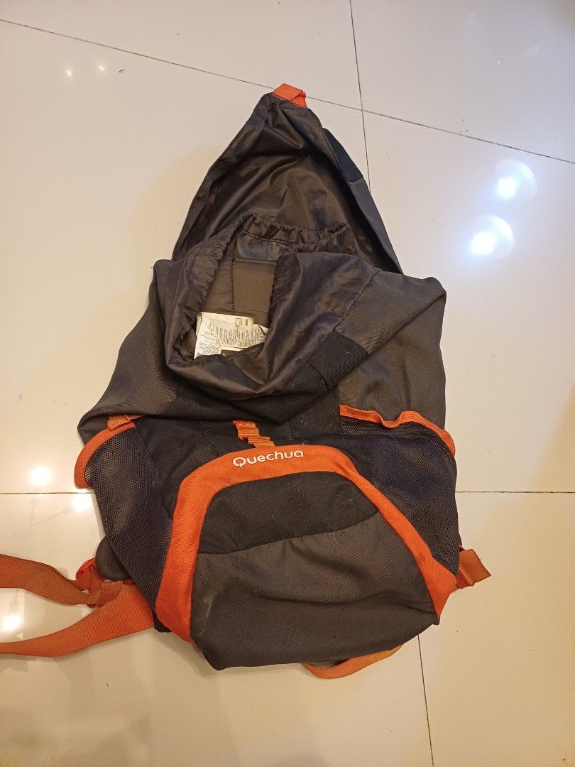 Quechua Arpenaz Backpack (Category: Backpacks) located in Imus. Submitted by bagginholicetc. (Listing ID 1436932566, Image 1). Description: 840 LAST PRICE FOR 500 pesos GOODS PA LALABHAN NYO LANG - Quechua Arpenaz backpack - Color: Dark grey and orange - Adjustable straps - Multiple compartments - Side pockets - Top flap closure - Designed for outdoor use - Brand and model visible.