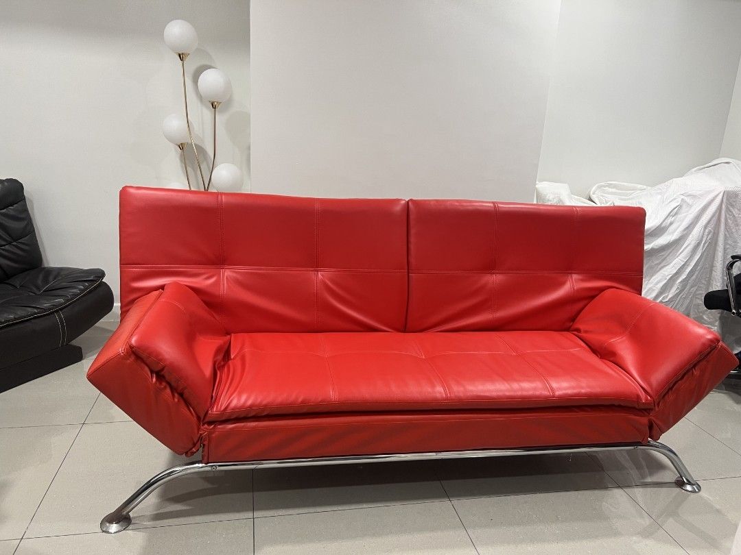 Red Leather Sofa Bed (Category: Sofas) located in Manila. Submitted by babyjayrudy (Listing ID 1437013948, Image 3). Description: - Red leather sofa bed with chrome frame - Modern design - Adjustable to different positions - Suitable for living rooms or guest rooms - Comfortable seating and sleeping experience.