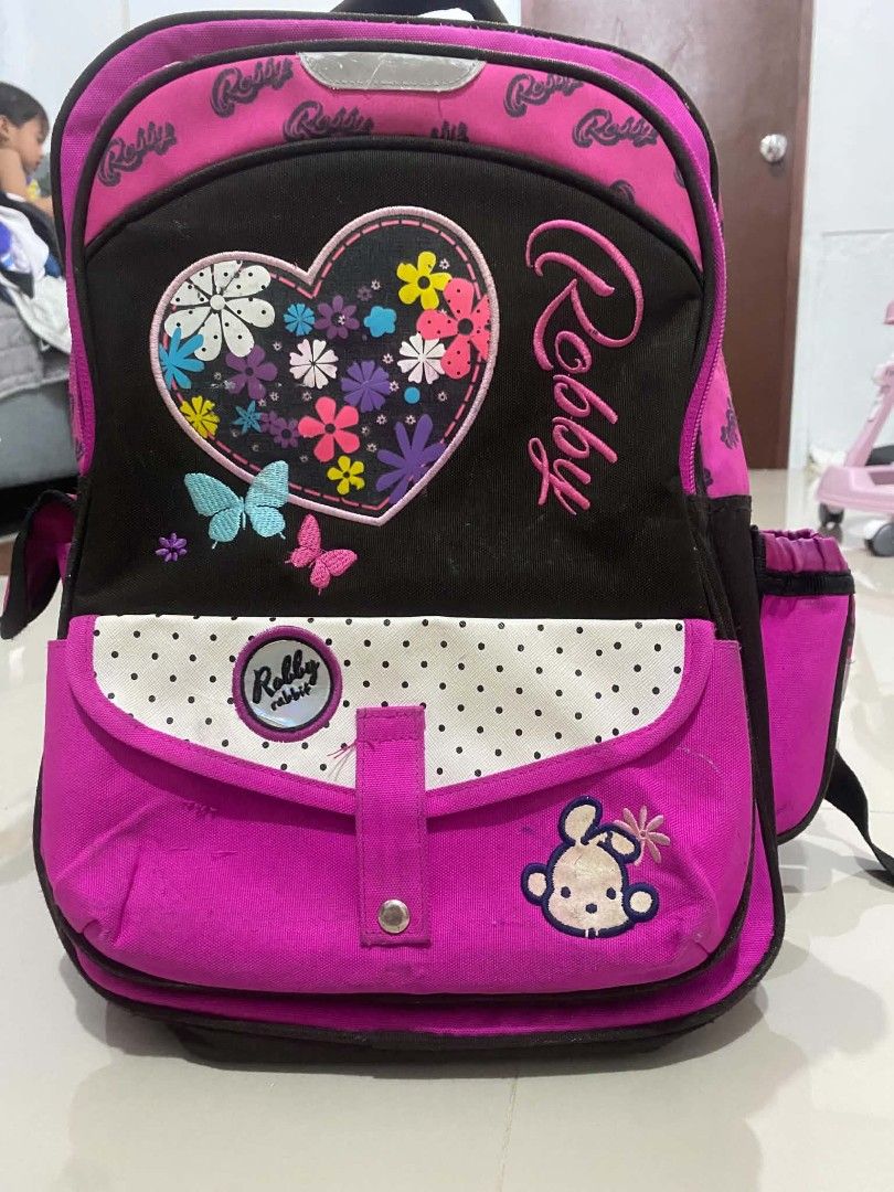 Robby Rabbit Backpack - Pink (Category: Backpacks) located in Taguig. Submitted by mouse2133_cloud (Listing ID 1436937270, Image 1). Description: - Robby Rabbit backpack - Pink and black design - Heart-shaped patch with flowers and butterflies - Front pocket with bunny design - Side pocket - Ideal for school or everyday use.