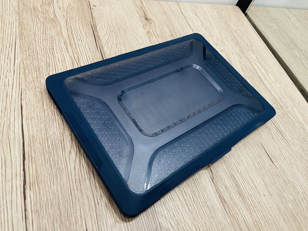MacBook Pro 13in Rugged Case - Navy Blue (Category: Laptop Bags & Sleeves) located in Quezon City. Submitted by ccgem (Listing ID 1436850016, Image 1). Description: - NavyBlue laptop case - Clear, hard shell design and rubberized corners - Textured pattern on the bottom - Includes securing clips - Snug fit for a specific laptop model: Macbook Pro 13in (2019-2020) - Protects against scratches and minor impacts - Has built-in collapsible kick stand