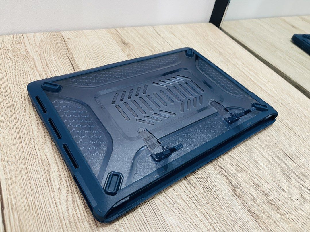 MacBook Pro 13in Rugged Case - Navy Blue (Category: Laptop Bags & Sleeves) located in Quezon City. Submitted by ccgem (Listing ID 1436850016, Image 3). Description: - NavyBlue laptop case - Clear, hard shell design and rubberized corners - Textured pattern on the bottom - Includes securing clips - Snug fit for a specific laptop model: Macbook Pro 13in (2019-2020) - Protects against scratches and minor impacts - Has built-in collapsible kick stand
