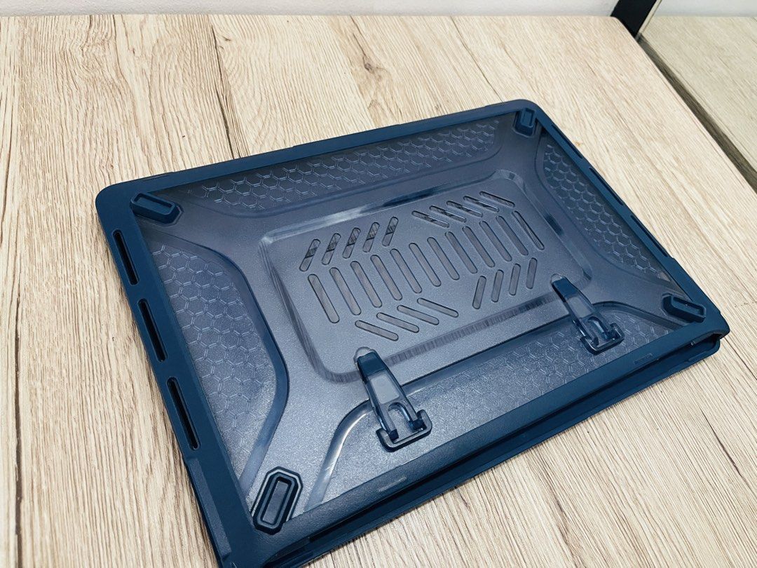 MacBook Pro 13in Rugged Case - Navy Blue (Category: Laptop Bags & Sleeves) located in Quezon City. Submitted by ccgem (Listing ID 1436850016, Image 2). Description: - NavyBlue laptop case - Clear, hard shell design and rubberized corners - Textured pattern on the bottom - Includes securing clips - Snug fit for a specific laptop model: Macbook Pro 13in (2019-2020) - Protects against scratches and minor impacts - Has built-in collapsible kick stand