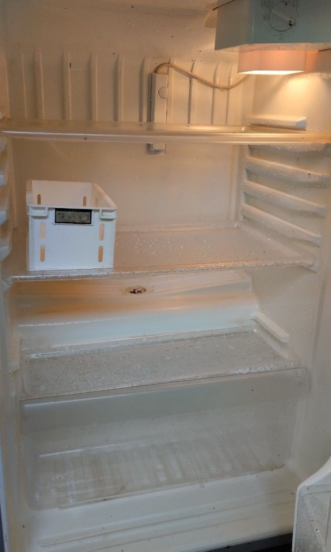Sanyo Refrigerator (SR-111J) (Category: Refrigerators and Freezers) located in Paranaque City. Submitted by nathan4you (Listing ID 1436831109, Image 3). Description: - Silver refrigerator with top freezer - Working condition - Needs step down transformer (110V) - Interior includes shelves and a small white container - Comes with power cord - Pick up only - Location: Parañaque City .
