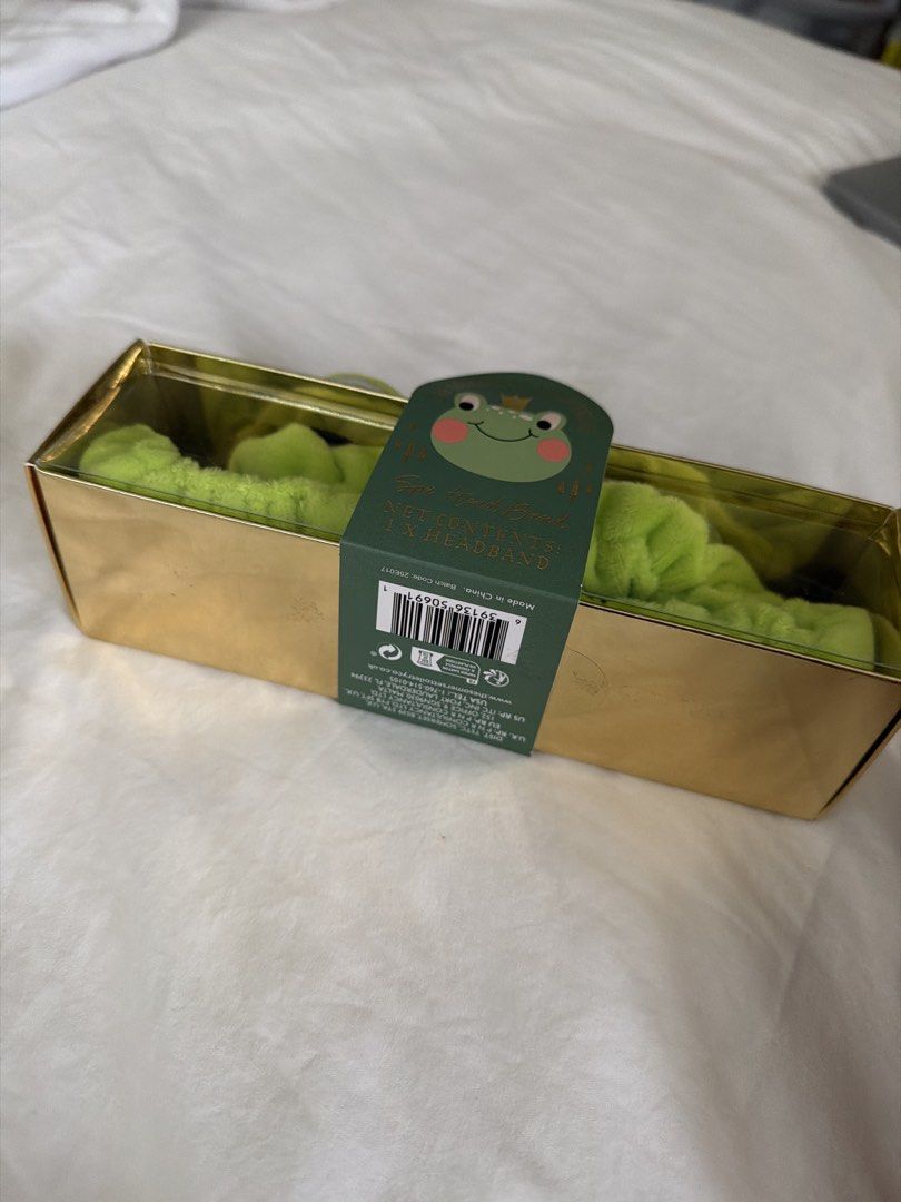 Somerset Toiletry Co. Frog Headband (Category: Hair Accessories) located in Makati City. Submitted by inezlebron (Listing ID 1436912788, Image 2). Description: - Cute frog design headband. - From The Somerset Toiletry Co. - Comes in a gold box. - Vibrant green color. - Comfortable and stylish. - Keeps hair out of your face. - Adds a touch of fun to your look..