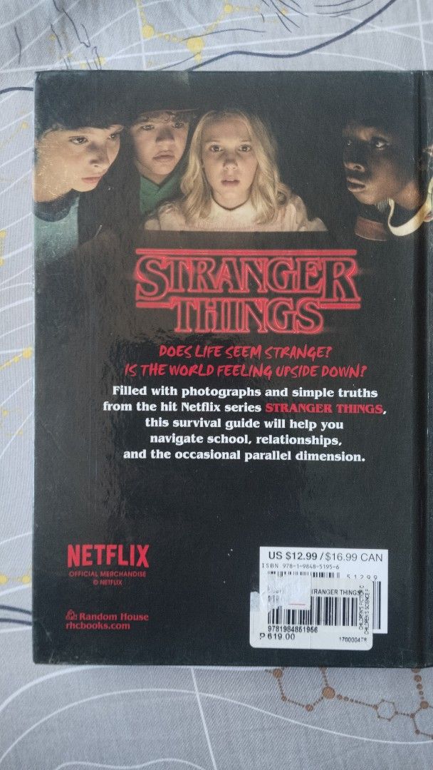 Stranger Things MERCH: How to Survive in a Stranger Things World (Category: Storybooks) located in Manila. Submitted by paololapuz39987 (Listing ID 1436858052, Image 2). Description: selling my Stranger things book for funds has minor flaws like seen on the 3rd picture. it's like scratches on the spine. shipping: lalamove area: San Pedro.