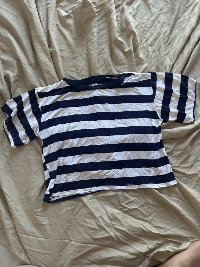 Striped Crop Top (Category: Shirts) located in Binan City. Submitted by missrandomthings (Listing ID 1436854254, Image 1). Description: - Navy blue and white striped design - Round neckline - Short sleeves - Lightweight fabric - Cropped style - Perfect for casual wear.