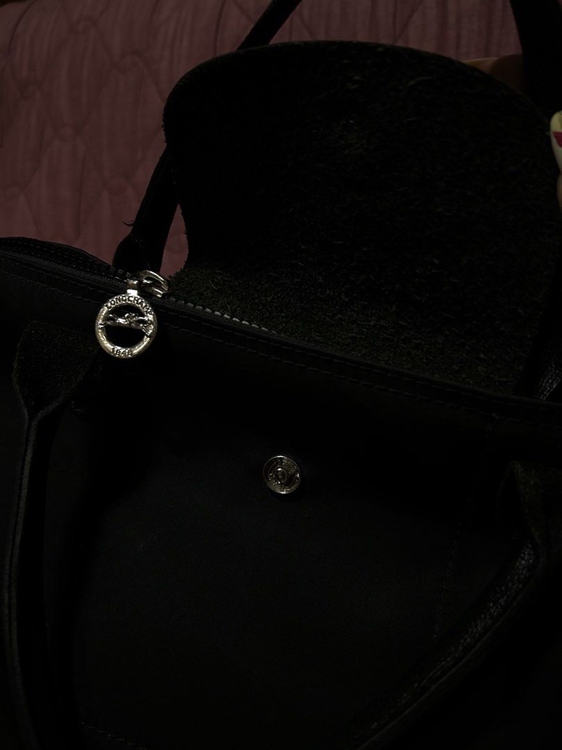 TAKE ALL (Category: Luxury Bags & Wallets) located in Batangas. Submitted by a_annika (Listing ID 1436959988, Image 3). Description: - Authentic Longchamp Le Pliage tote bag - Black nylon body with leather accents - Features a top handle and detachable shoulder strap - Secure snap and zipper closures - Clean interior - Perfect for everyday use - Stylish and versatile design.