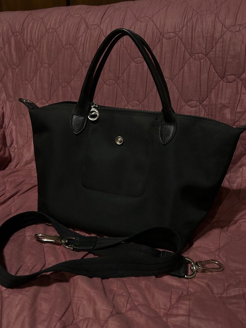 TAKE ALL (Category: Luxury Bags & Wallets) located in Batangas. Submitted by a_annika (Listing ID 1436959988, Image 1). Description: - Authentic Longchamp Le Pliage tote bag - Black nylon body with leather accents - Features a top handle and detachable shoulder strap - Secure snap and zipper closures - Clean interior - Perfect for everyday use - Stylish and versatile design.