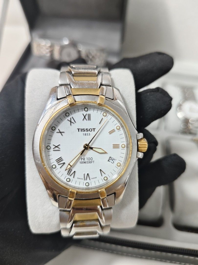 TISSOT WATCH (Category: Luxury Watches) located in Manila. Submitted by rhian_1994 (Listing ID 1436901810, Image 2). Description: Case Size: Approximately 37mm to 39mm.Movement: Precise Swiss Quartz.Water Resistance: Rated for 100 meters (330 feet), suitable for swimming but not deep diving.Dial Features: Includes a date window at the 4 o'clock position and luminescent hands for visibility in low light.Materials: Built with a scratch-resistant sa