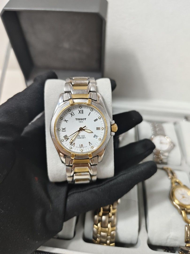 TISSOT WATCH (Category: Luxury Watches) located in Manila. Submitted by rhian_1994 (Listing ID 1436901810, Image 1). Description: Case Size: Approximately 37mm to 39mm.Movement: Precise Swiss Quartz.Water Resistance: Rated for 100 meters (330 feet), suitable for swimming but not deep diving.Dial Features: Includes a date window at the 4 o'clock position and luminescent hands for visibility in low light.Materials: Built with a scratch-resistant sa