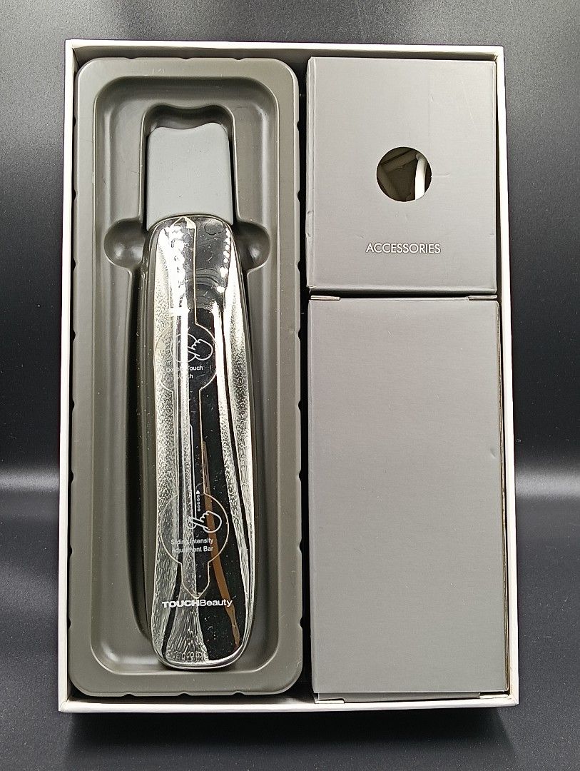 TOUCHBeauty Ultrasonic Scrub Device TB-1769 (Category: Face Care) located in La Trinidad. Submitted by cherishedtreasures (Listing ID 1436932828, Image 1). Description: - TOUCHBeauty Ultrasonic Scrub Device TB-1769 - Silver design - Rechargeable and water-resistant - Includes charging cable and accessories - Designed for facial exfoliation and cleansing - Box includes diagrams for easy use.