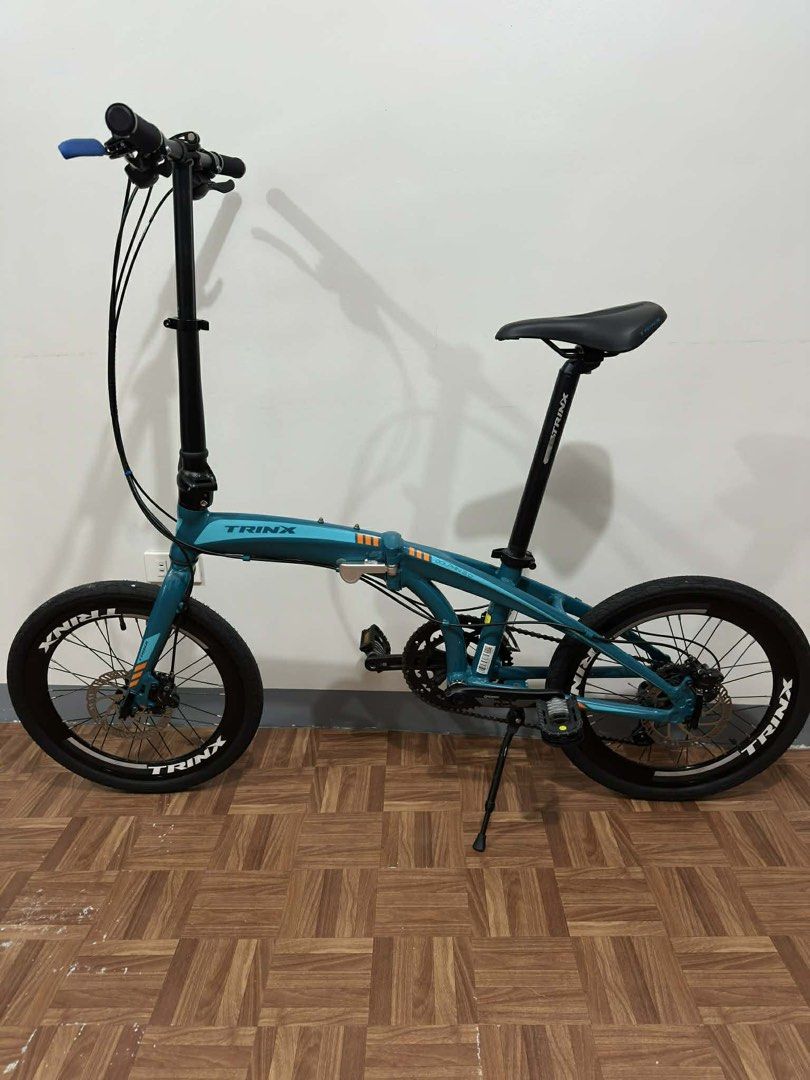 Trinx Dolphin 3.0 Folding Bike (Category: Bicycles) located in Las Pinas. Submitted by _mgzm (Listing ID 1436925023, Image 2). Description: Overall Condition: 9/10 Cosmetic: Has some minor scratches and typical dents from folding and storage (doesn't affect performance) Mechanical: 100% working condition. Smooth shifting and crisp braking. Maintenance: Well-maintained, ready to ride. REASON FOR SELLING: Moving away from biking and decluttering. T