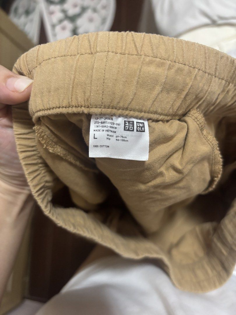 Uniqlo Relaxed Pants - Size L (Category: Other Bottoms) located in Cebu City. Submitted by teveschels38656 (Listing ID 1436962409, Image 2). Description: - Uniqlo Relaxed Pants - Color: Tan - Size: L (Waist: 68-75cm, Hips: 94-100cm) - Features: Elastic waistband, side pockets - Material: 100% Cotton - Perfect for everyday wear.