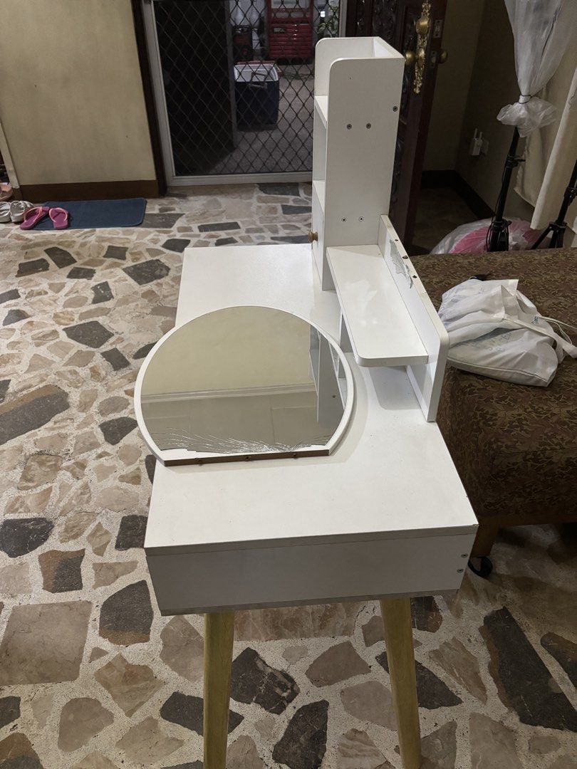 Vanity Table with Mirror (Category: Tables & Sets) located in Manila. Submitted by frncbenz_ (Listing ID 1437012711, Image 3). Description: - Vanity table with mirror - Features two drawers, a shelf, and a small cabinet - Supported by wooden legs - Dimensions: 80cm (length) x 40cm (width) x 75cm (height) - Mirror has some damage - Originally priced at P2800.