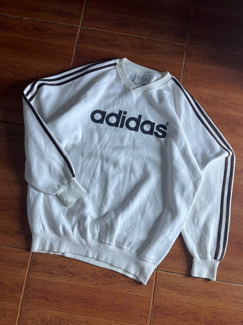 Vintage 90's adidas sweater (Category: Coats, Jackets and Outerwear) located in Quezon City. Submitted by thomosssss (Listing ID 1436973254, Image 1). Description: size large to semi xl issue minimal yellow stain on front and bleech stain on 3 lines super tight ribbings complete tags.