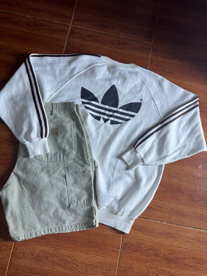 Vintage 90's adidas sweater (Category: Coats, Jackets and Outerwear) located in Quezon City. Submitted by thomosssss (Listing ID 1436973254, Image 2). Description: size large to semi xl issue minimal yellow stain on front and bleech stain on 3 lines super tight ribbings complete tags.