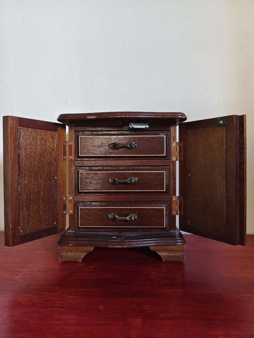 Vintage Mini Jewelry Cabinet (Category: Other Home Decor) located in Tarlac. Submitted by clarion.picks (Listing ID 1436898036, Image 2). Description: Vintage Mini Jewelry Cabinet Solid dark wood Vintage floral tapestry on doors Music plays when last drawer is pulled.