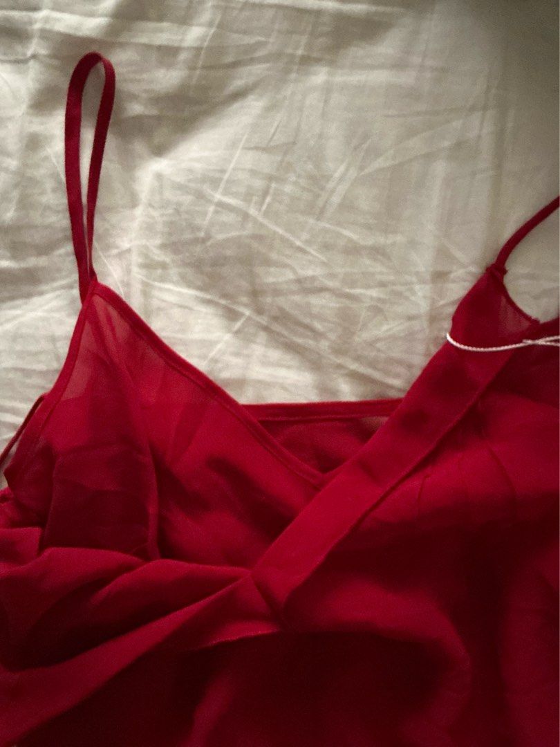 WEAR KAHEL Red Double Tank Top (Category: Sleeveless) located in Pasay City. Submitted by robinesbin (Listing ID 1436897335, Image 2). Description: - New red double cami top - Features delicate straps - Flowing design - Lightweight fabric - Unique cut and design.