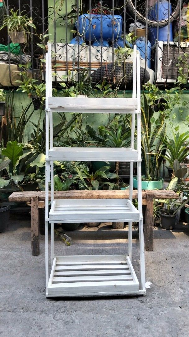 White Wooden Plant Stand (Category: Plants & Seeds) located in Valenzuela. Submitted by chris_cruz (Listing ID 1436855338, Image 1). Description: -LOCATION: North Caloocan (Deparo) - White wooden plant stand - 4-tier design - Ladder-style construction - Foldable for easy storage - Slatted shelves - Painted white - Price negotiable.