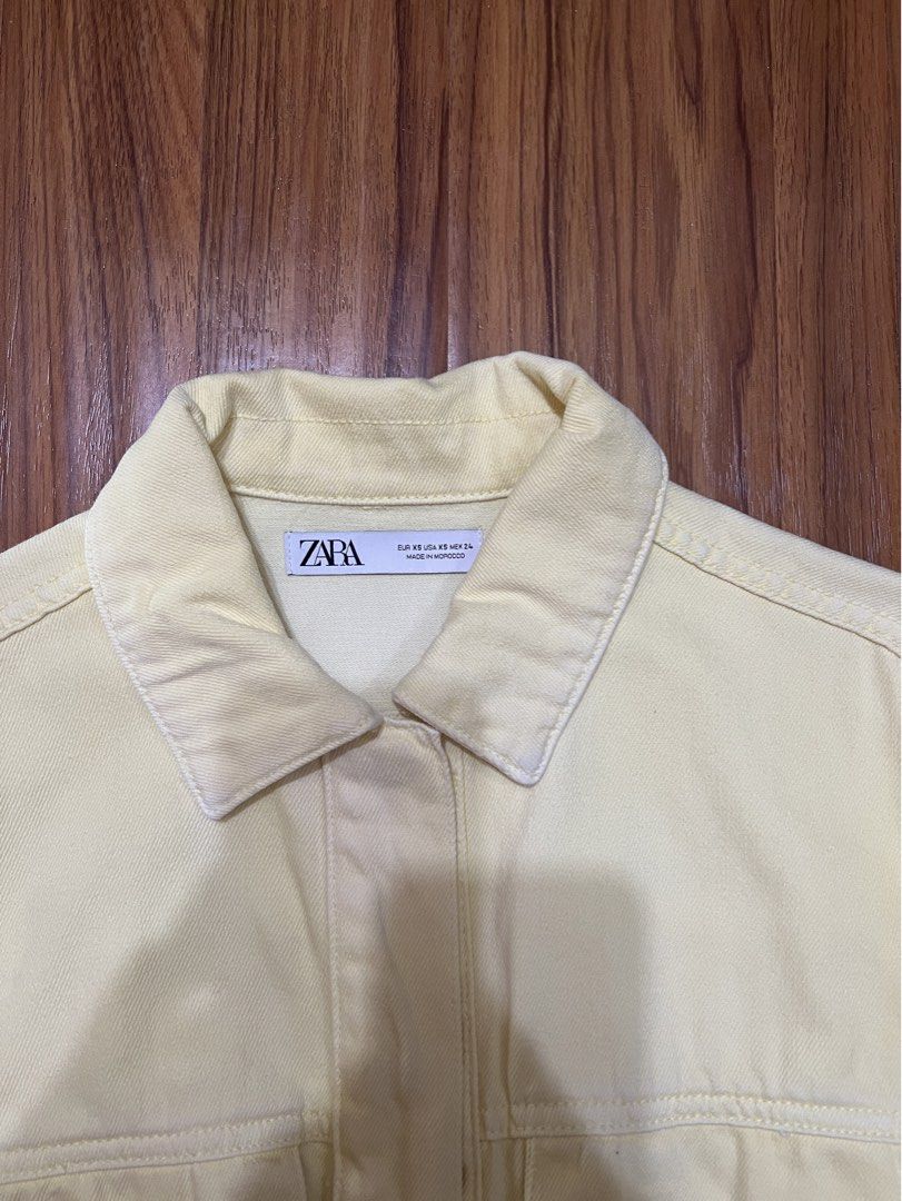Zara Butter Yellow Denim Jacket XS | 100% Cotton (Category: Coats, Jackets and Outerwear) located in Manila. Submitted by everythingbrandedpreloved_ (Listing ID 1436875930, Image 2). Description: Brand: Zara Size: XS (fits up to semi M) Condition: Lightly used, worn a few times, excellent condition overall (no fading apart from the tag part, not seen unless upclose) Other details (condition): - Butter yellow denim jacket with a soft, vibrant tone