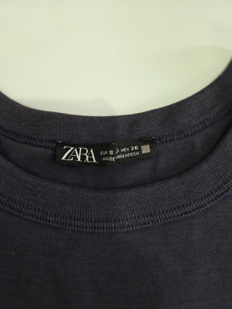 Zara Dark Gray T-shirt (Category: Shirts) located in Bacolod City. Submitted by maraline (Listing ID 1436940895, Image 3). Description: - Zara dark gray t-shirt - Size: S. fits semi-Medium - Features: Round neck, short sleeves - Made in Bangladesh - Solid color, simple design - Soft, comfortable and stretchy fabric - Perfect for casual wear Great for layering or wearing as a clean, minimalist staple piece 047.