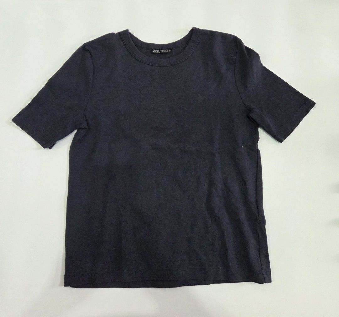 Zara Dark Gray T-shirt (Category: Shirts) located in Bacolod City. Submitted by maraline (Listing ID 1436940895, Image 2). Description: - Zara dark gray t-shirt - Size: S. fits semi-Medium - Features: Round neck, short sleeves - Made in Bangladesh - Solid color, simple design - Soft, comfortable and stretchy fabric - Perfect for casual wear Great for layering or wearing as a clean, minimalist staple piece 047.