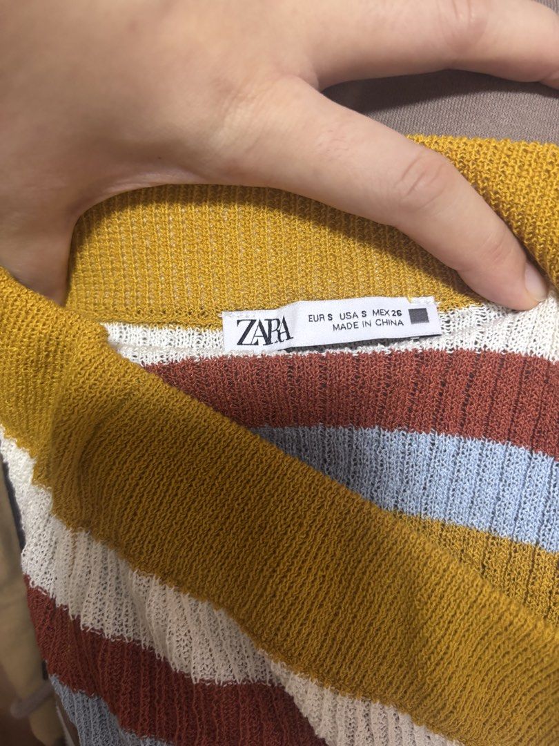 Zara Striped Knit Skirt (Category: Skirts) located in Cebu City. Submitted by teveschels38656 (Listing ID 1436961700, Image 2). Description: - Zara striped knit skirt - Size S - Colorful striped pattern - Ribbed texture - Midi length - Fitted silhouette - Made in China.