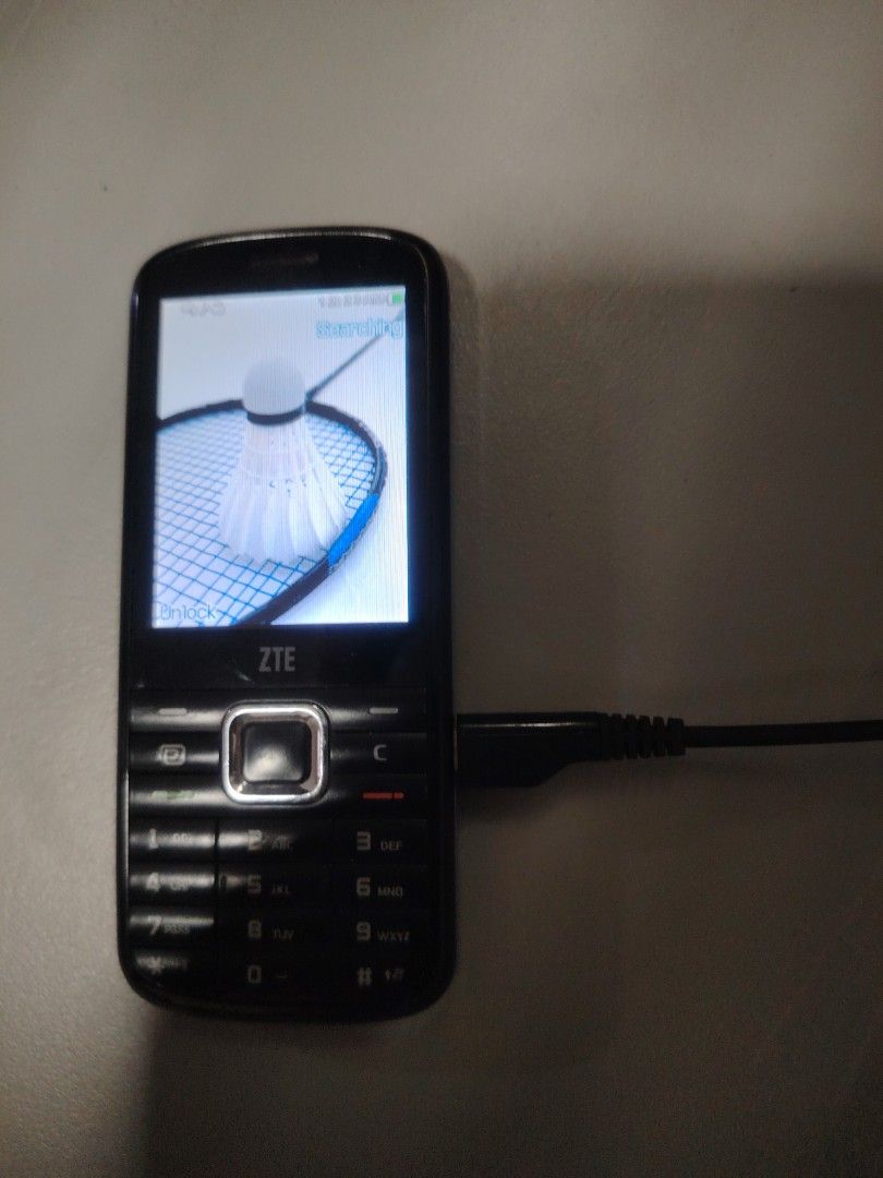 ZTE Basic Phone - Working Condition (Category: Early Generation Mobile Phones) located in Singapore. Submitted by cckyp76 (Listing ID 1436977113, Image 2). Description: - ZTE basic phone(I do not know the actual storage) - Good working condition - Includes charging cable - Screen displays images - Perfect for basic communication.