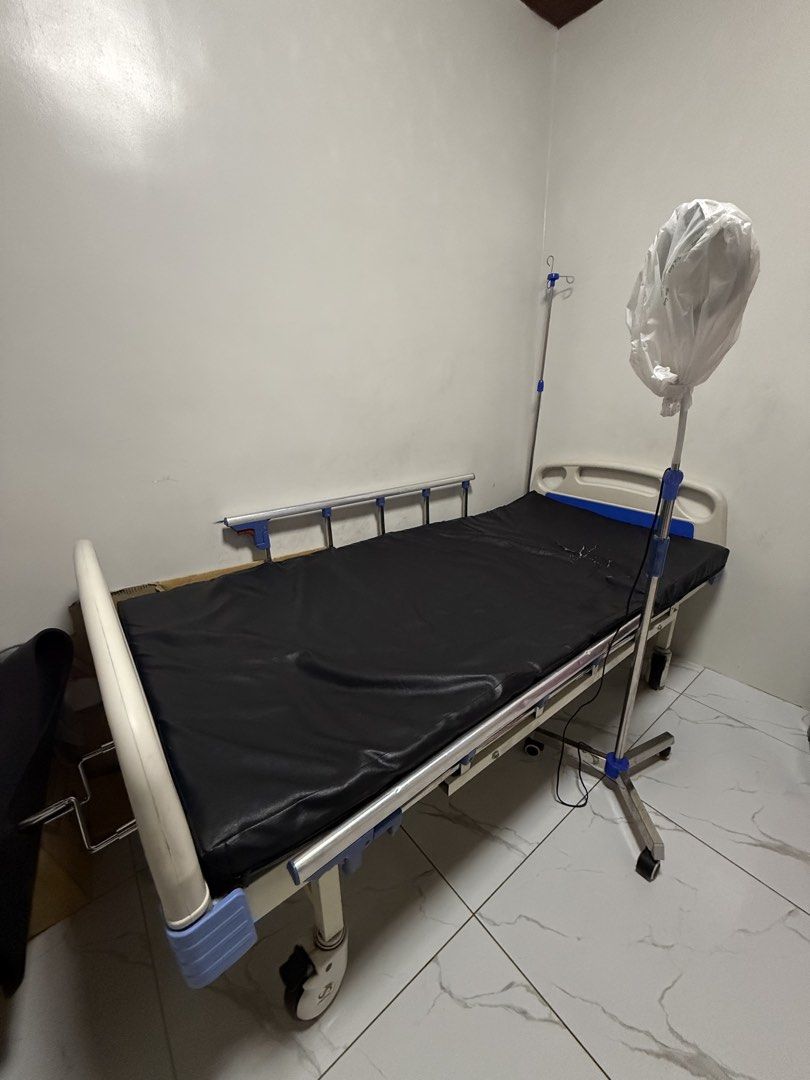 2 Cranks Adjustable Hospital Bed with IV Pole & Over Bed Table (Category: Medical Supplies & Tools) located in Manila. Submitted by patletsgo (Listing ID 1441356633, Image 1). Description: 2 cranks hospital bed for sale ₱7500 - with black leatherette mattress (leather sheet can be removed and changed) - with IV pole + over bed table - with wheels for easy transport - Perfect for home care or medical facilities thermal light stand ₱1200 - new. not
