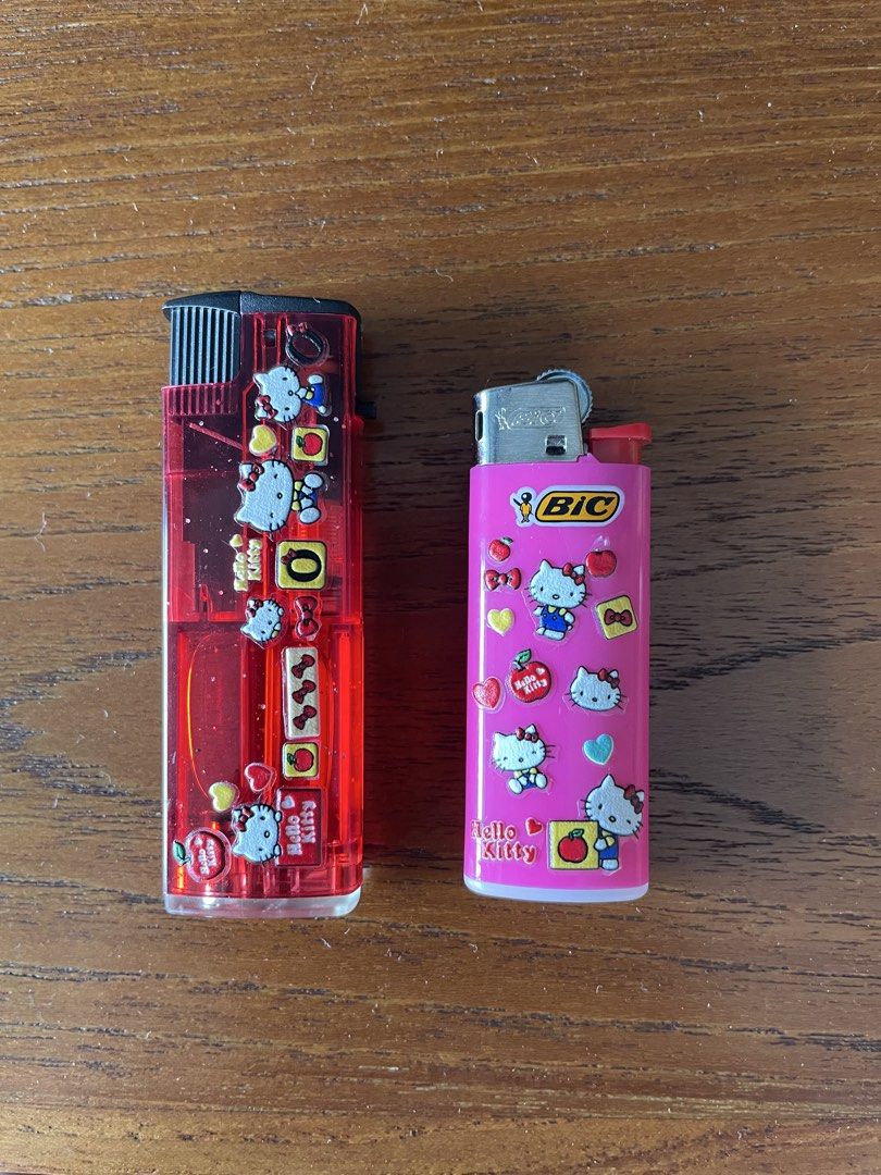 2x Hello Kitty Lighters - Pink BIC and Red (Category: Vintage Collectibles) located in Singapore. Submitted by cherrybomb777 (Listing ID 1441160563, Image 1). Description: - Set of 2 cute Kitty lighters - Pink BIC lighter featuring various Kitty designs - Ideal for Kitty collectors or for everyday use.