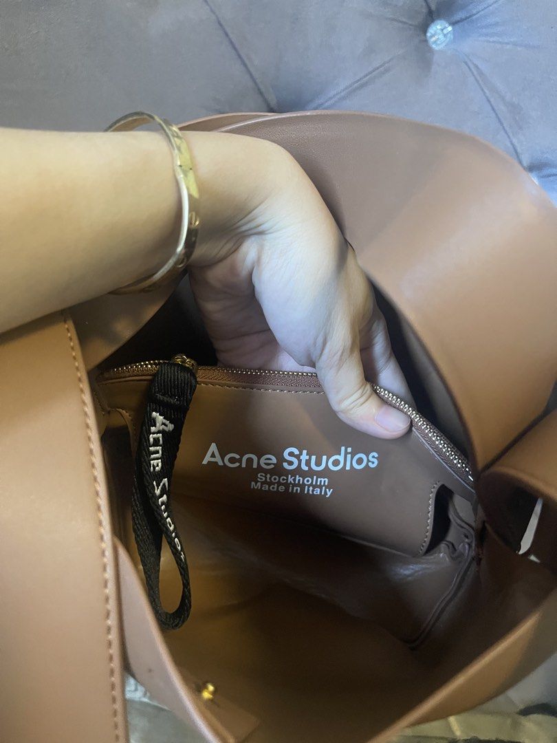 Acne Studios Musubi Mini Bag (Category: Luxury Bags & Wallets) located in Roxas City. Submitted by lynngreyartillero (Listing ID 1441356954, Image 2). Description: - Acne Studios Musubi Mini bag - Color: Tan/Brown - Material: Genuine Leather - Iconic knot detail - Compact size, ideal for essentials - Interior label: Acne Studios Stockholm Made in Italy - Selling as it's not being used enough.