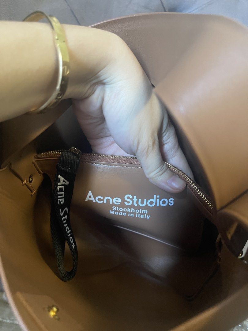 Acne Studios Musubi Mini Bag (Category: Luxury Bags & Wallets) located in Roxas City. Submitted by lynngreyartillero (Listing ID 1441356954, Image 3). Description: - Acne Studios Musubi Mini bag - Color: Tan/Brown - Material: Genuine Leather - Iconic knot detail - Compact size, ideal for essentials - Interior label: Acne Studios Stockholm Made in Italy - Selling as it's not being used enough.