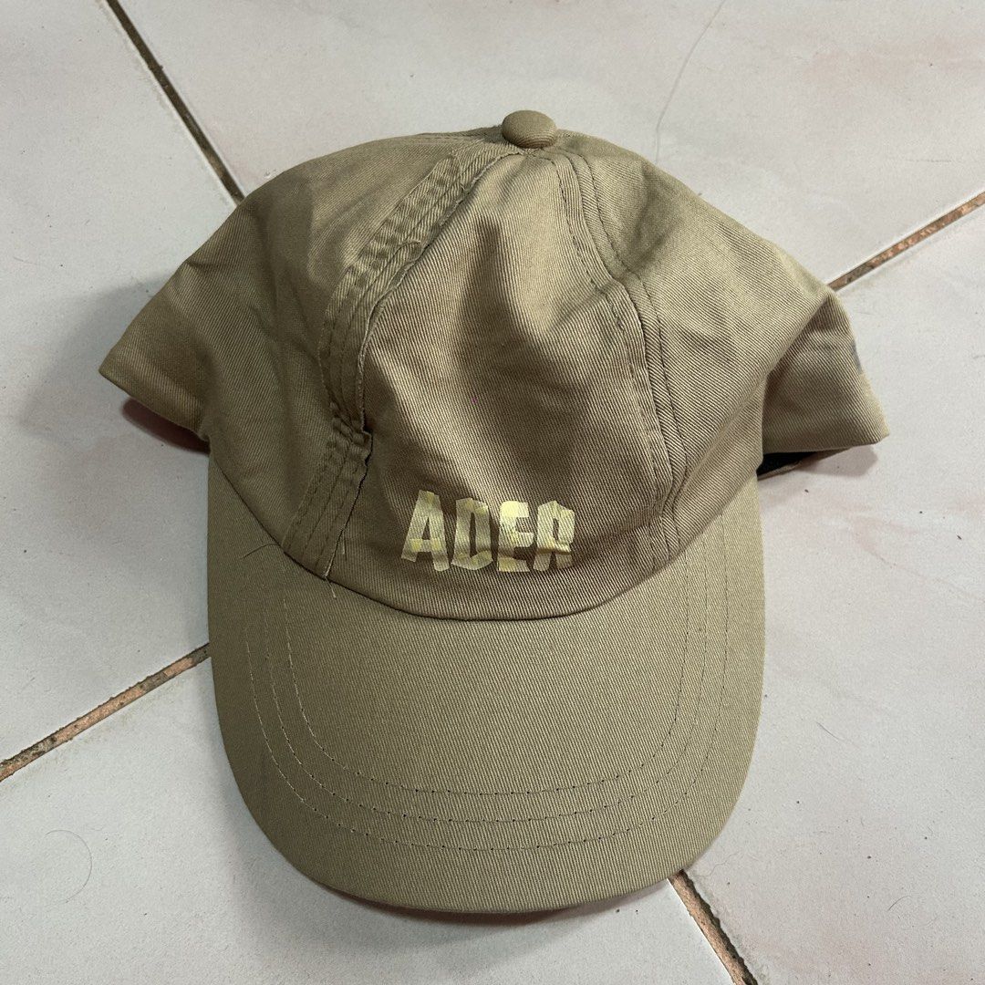 Ader Error Beige Cap 🔥 (Category: Caps & Hats) located in Jinoba-an. Submitted by eegiboy (Listing ID 1441207592, Image 1). Description: - Beige Ader Error cap - Adjustable strap with black buckle at the back - Signs of wear on stitching and fabric, particularly around the edges issue: stain ( see last pic) 600plussf Dm me if interested thankyou.