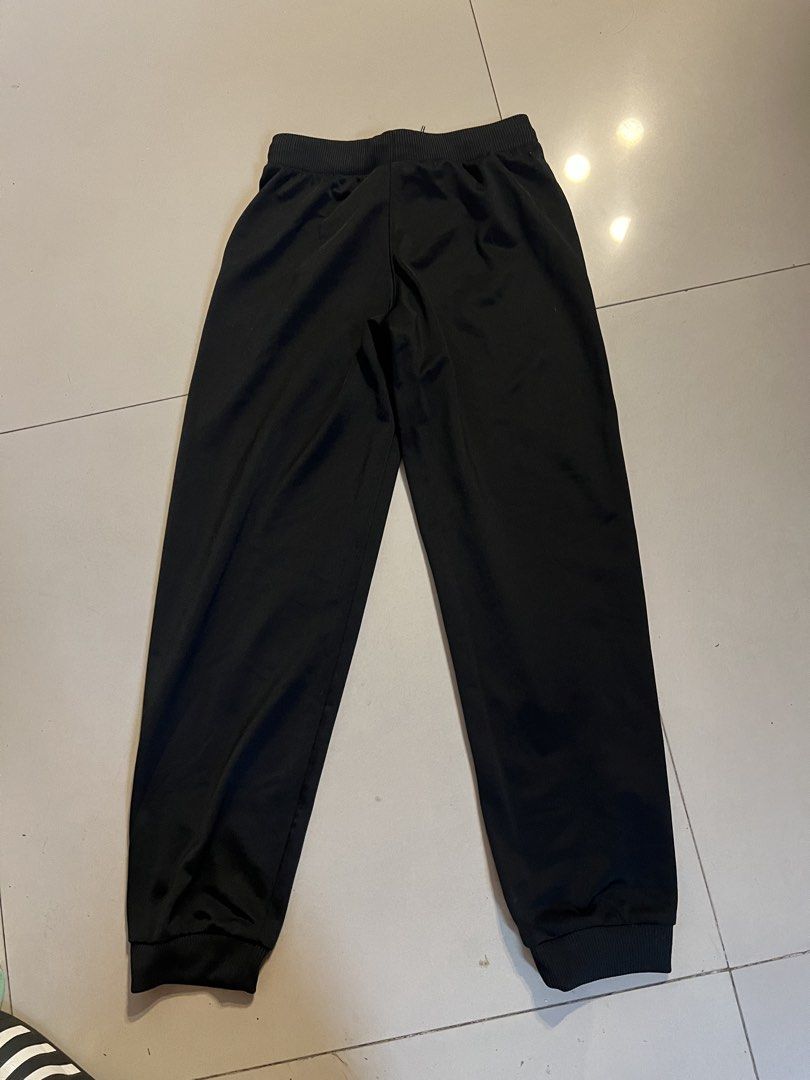 Adidas Black Track Pants Joggers (Category: Other Bottoms) located in Makati City. Submitted by abbynak (Listing ID 1441255037, Image 2). Description: Adidas black track pants. Elastic waistband, drawstring, cuffed ankles. Adidas logo. Comfortable. Good for sports/casual wear..