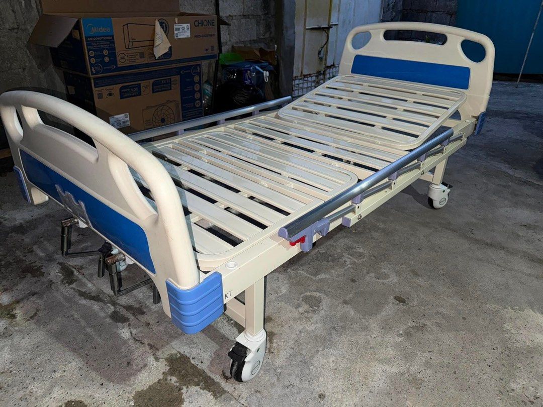 Adjustable Hospital Bed with Side Rails and Wheels (Category: Medical Supplies & Tools) located in Manila. Submitted by angellove0701_leumas (Listing ID 1440988371, Image 2). Description: - Manual hospital bed - Adjustable backrest and leg rest via cranks - Safety side rails included - Smooth rolling wheels for easy mobility - IV pole attachment point - nag migrate na may ari.