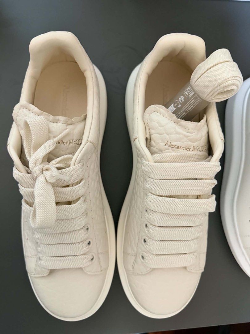 Alexander McQueen Oversized Sneakers Cream Crocodile Embossed (Category: Sneakers) located in Makati City. Submitted by decluttering822 (Listing ID 1441251002, Image 3). Description: - Cream Alexander McQueen oversized sneakers - Crocodile embossed leather - Classic chunky sole - Comes with extra laces - Ideal for everyday wear - Please check photos for condition details.