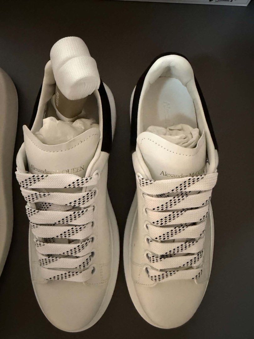 Alexander McQueen Oversized Sneakers White Black (Category: Sneakers) located in Makati City. Submitted by decluttering822 (Listing ID 1441251507, Image 2). Description: - White leather sneakers - Black heel tab detail - Signature oversized sole - Black and white patterned laces.