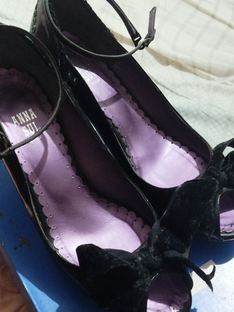 Anna Sui Black Patent Heels with Velvet Bows (Category: Heels) located in Caloocan City. Submitted by sunrizel (Listing ID 1441284018, Image 1). Description: Anna Sui black patent leather Mary Jane heels with a velvet bow and ankle strap. (Bows are pitch black irl, they just look weird on the first pic). Features a purple scalloped lining. Perfect for dressing up! Bought on Carousell a year ago, I've worn this only once indoors as I'm one size do