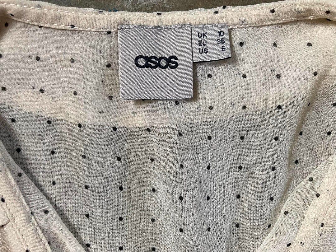 ASOS polka Dot Ruffle Collar Sleeveless Blouse (Category: Blouses) located in Cavite. Submitted by eures_corner (Listing ID 1441193115, Image 3). Description: - Cute white sleeveless blouse - Black polka dot print - Ruffled collar - Button-up front - Ideal for warm weather - Versatile: pairs well with jeans or skirts - Suitable for casual or dressy occasions.